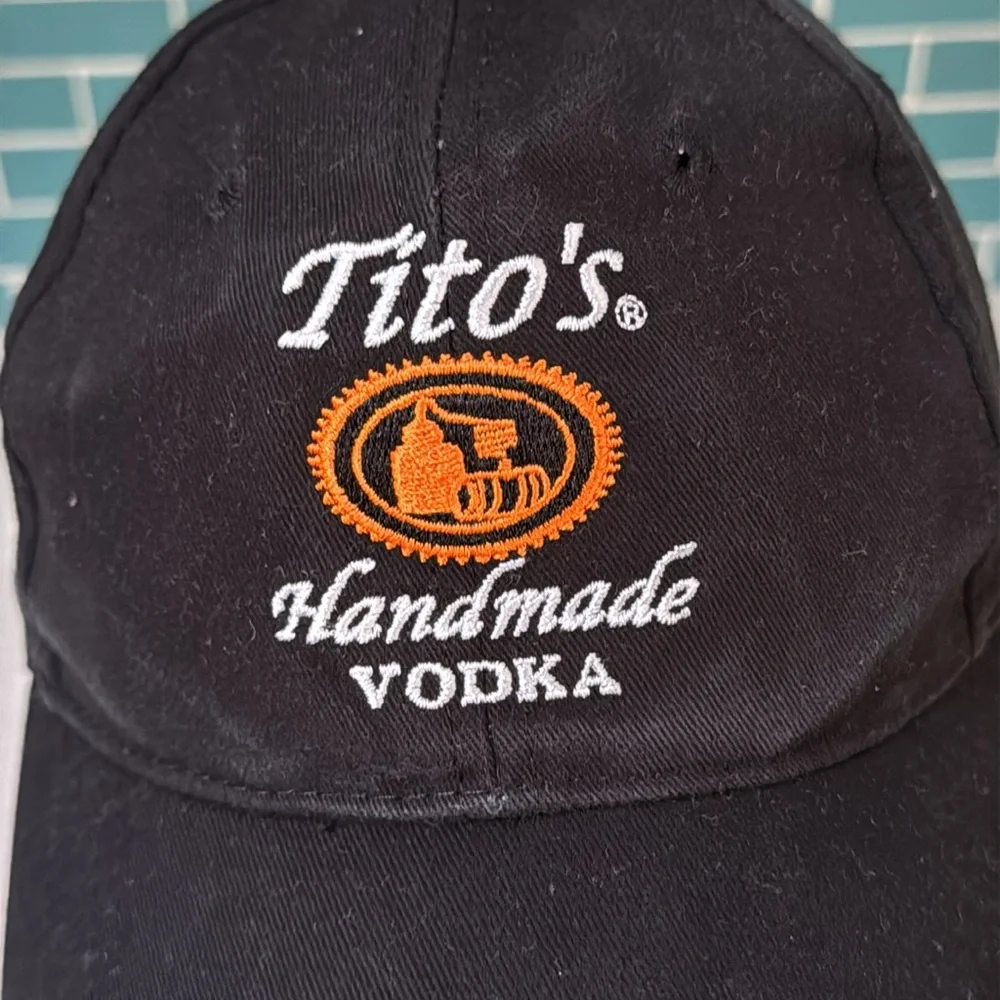 Tito’s Handmade Vodka black orange embroidered Texas adjustable baseball hat